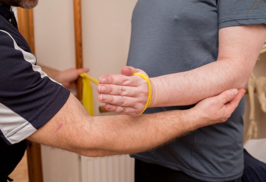 Men receiving Tennis Elbow Treatment