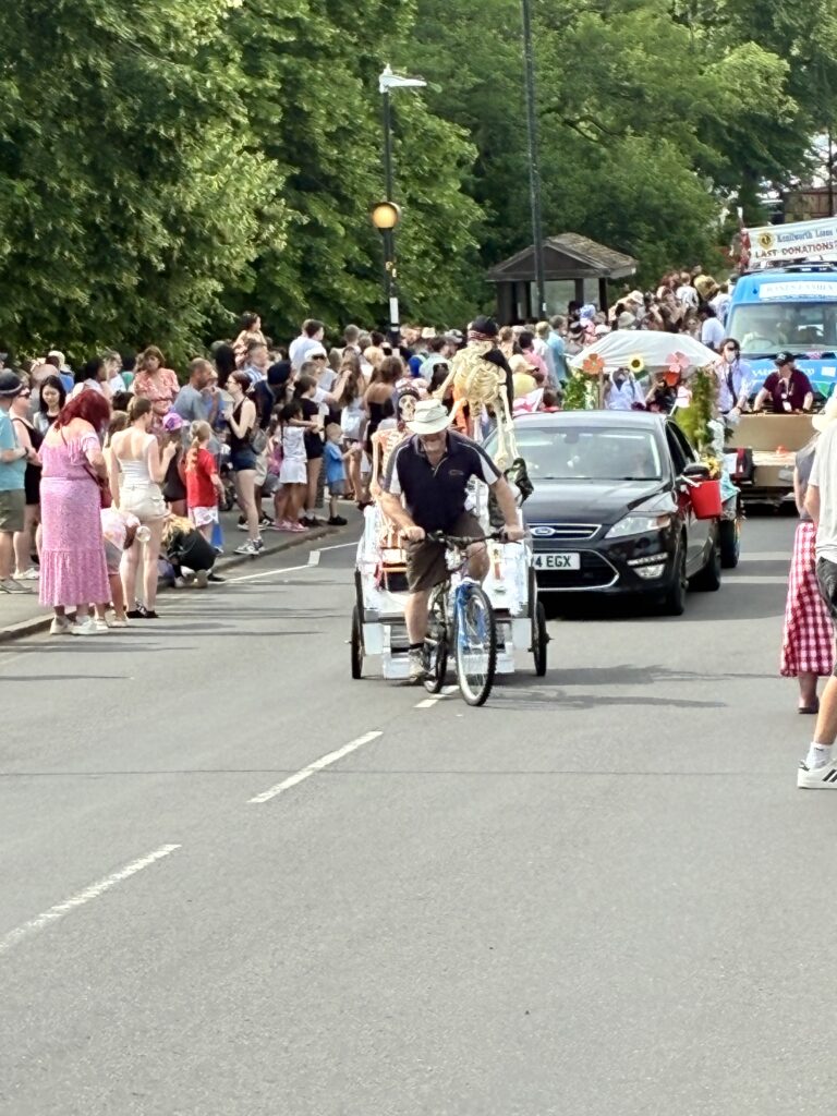 Ian from The Reinge Clinic cycling up Rosemary Hill for The Kenilworth Carnival